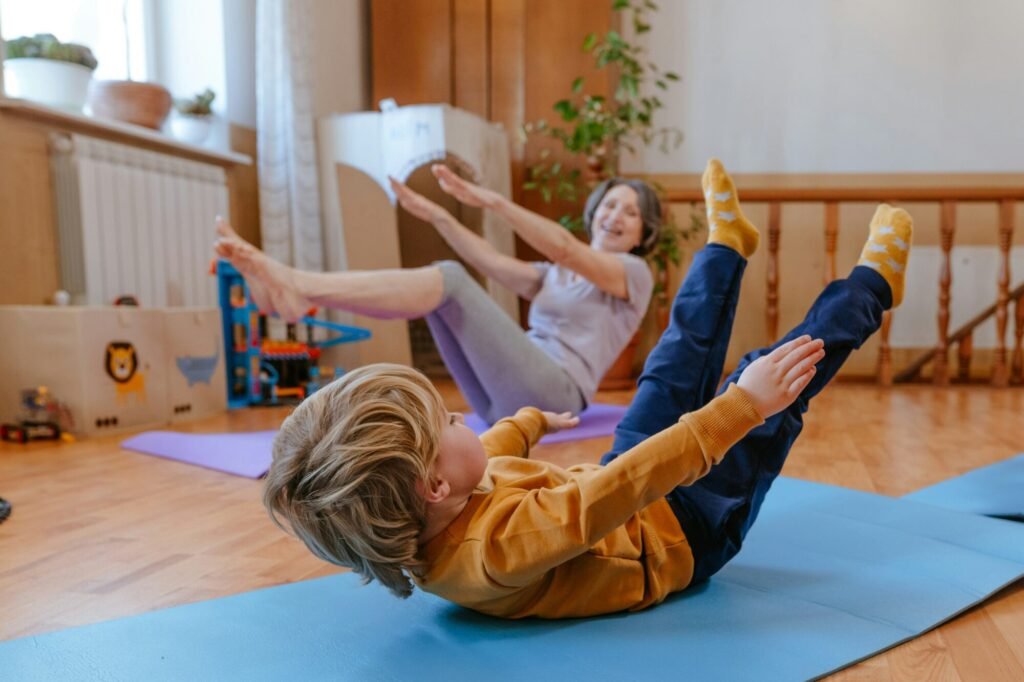 Child and parent practicing yoga together.