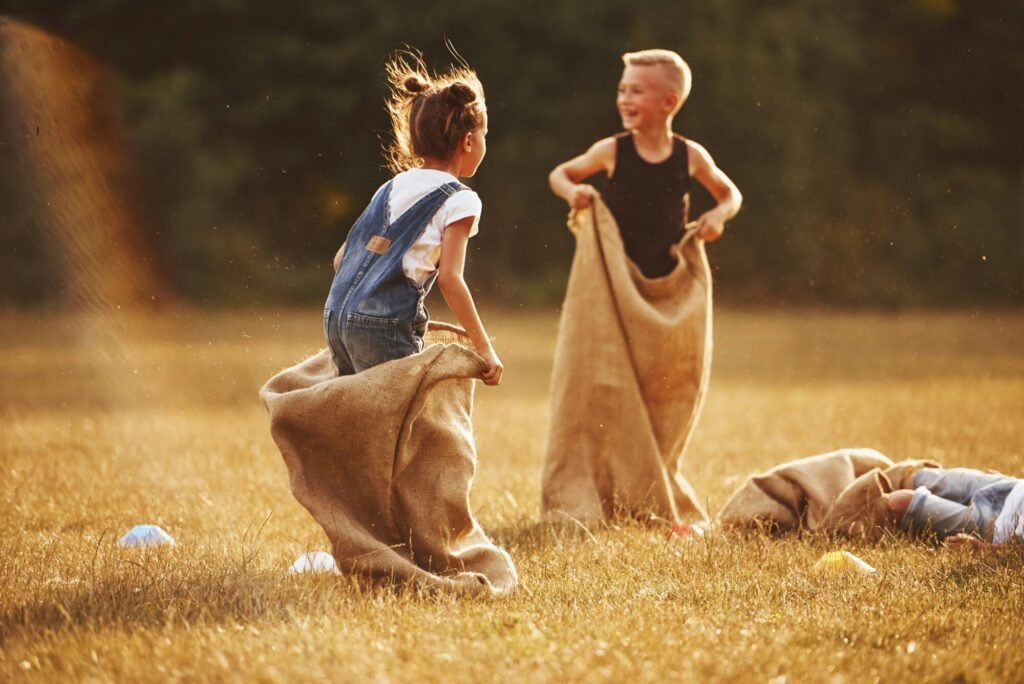 Two kids in a sack race, a fun outdoor game